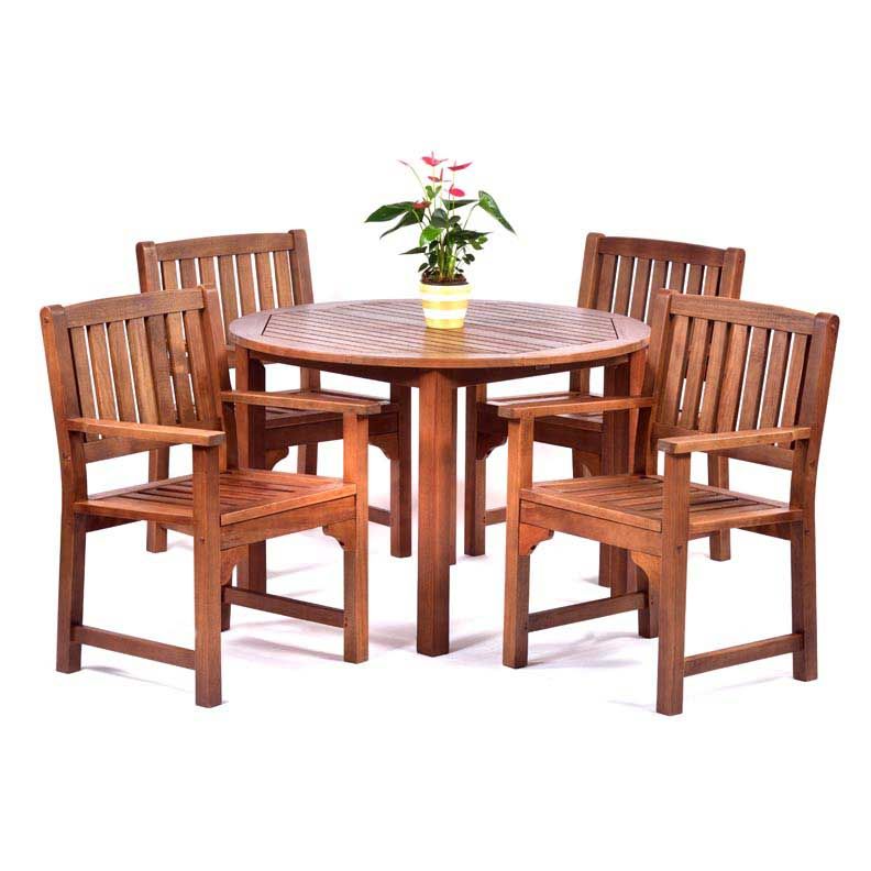Round dining table with four arm chairs